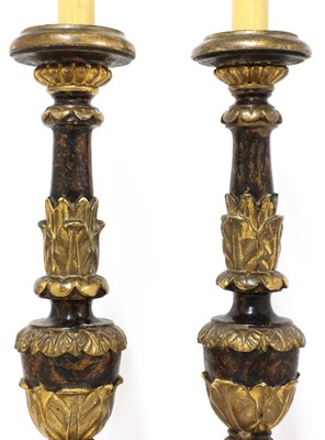 Lot 119 - A pair of Continental giltwood and painted altar candlesticks