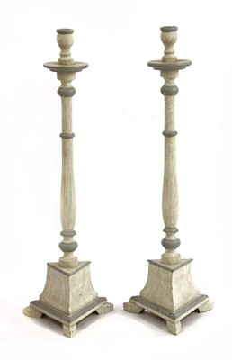 Lot 273 - A pair of large turned wooden painted candlesticks