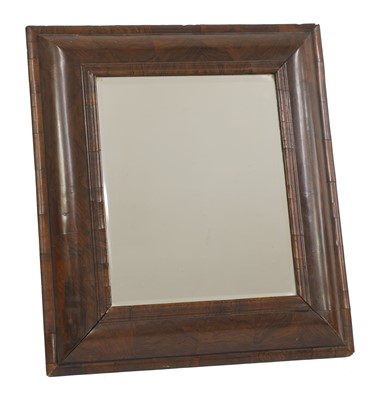 Lot 585 - A William and Mary cushion-framed walnut-veneered mirror