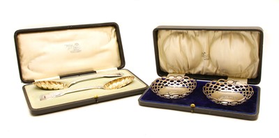 Lot 180 - A matched pair of silver gilt berry spoons
