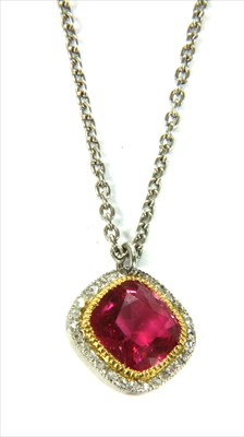 Lot 19 - A platinum pink tourmaline and diamond halo cluster pendant