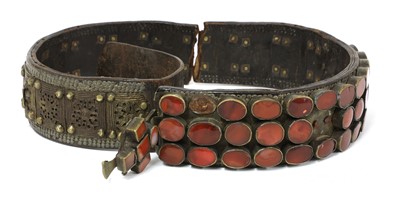 Lot 195 - A Moghul Indian leather, brass and cornelian agate set elephant's foot collar