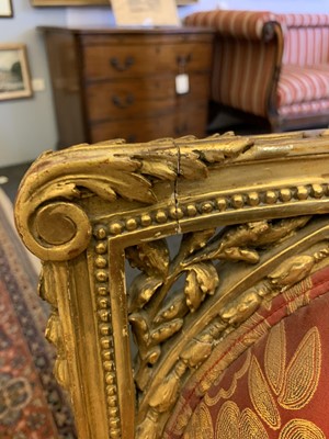 Lot 692 - A pair of French Louis XVI-style giltwood salon chairs
