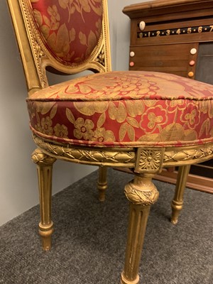 Lot 692 - A pair of French Louis XVI-style giltwood salon chairs