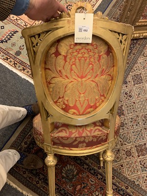 Lot 692 - A pair of French Louis XVI-style giltwood salon chairs
