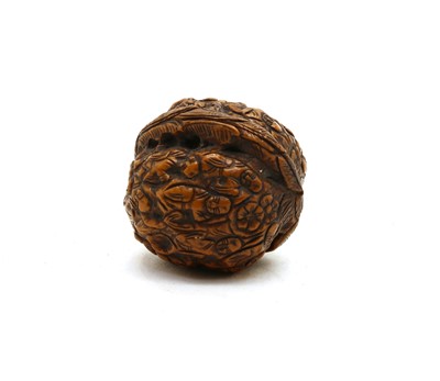 Lot 67 - A Chinese complete walnut shell