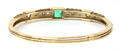 Lot 8 - A late Victorian emerald and diamond hinged bangle, c.1880