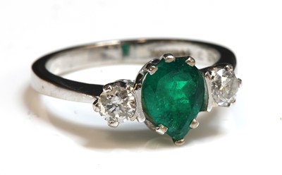 Lot 237 - An 18ct white gold emerald and diamond three stone ring
