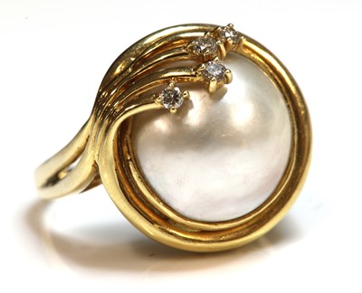 Lot 169 - A gold cultured mabé pearl and diamond ring