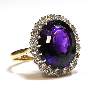 Lot 245 - An amethyst and diamond oval cluster ring