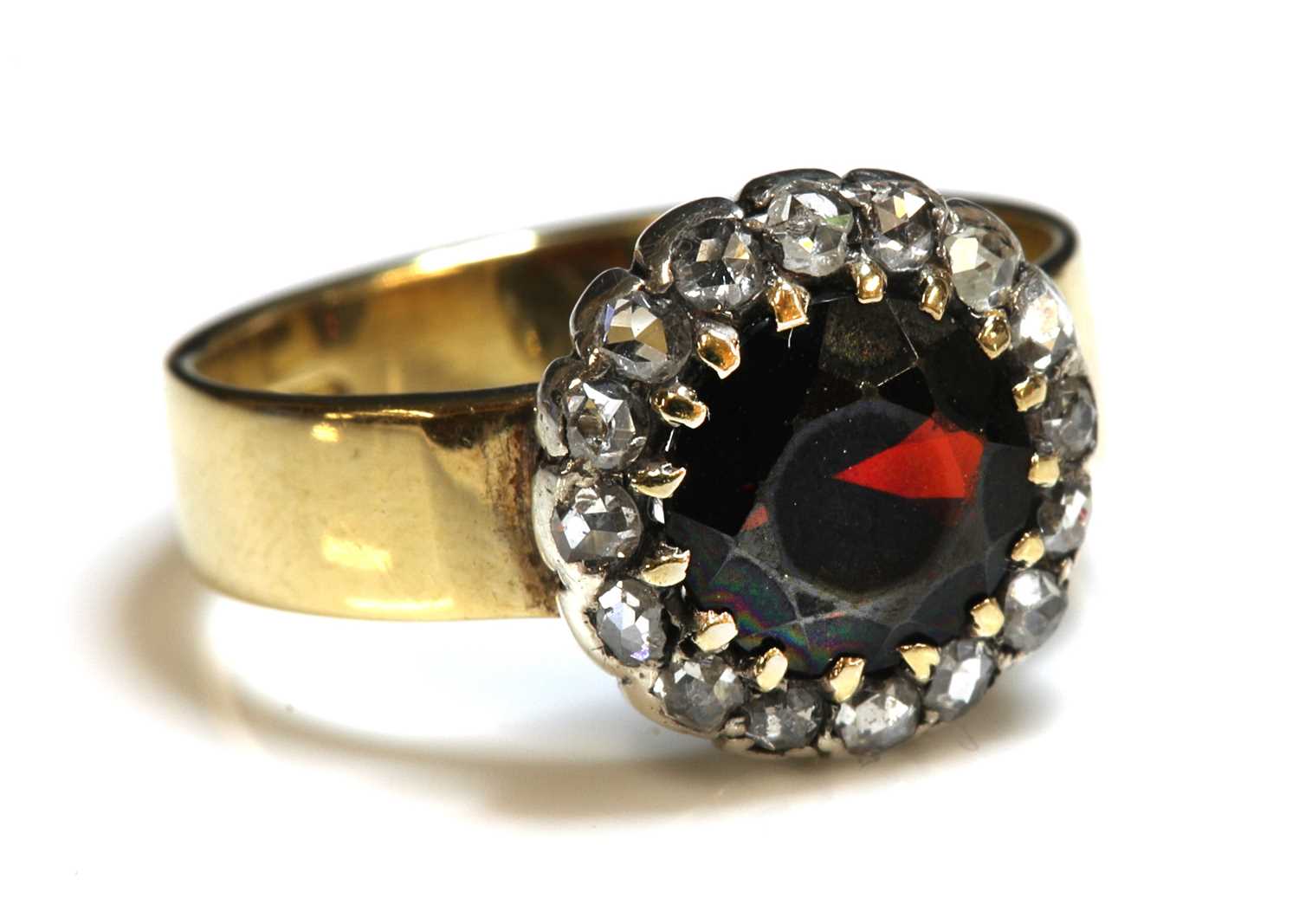 Lot 92 - A garnet and diamond cluster ring