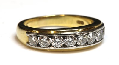 Lot 292 - An 18ct two colour gold diamond set half hoop ring by Boodle & Dunthorne, c.2000