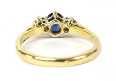 Lot 63 - An 18ct gold sapphire and diamond three stone ring