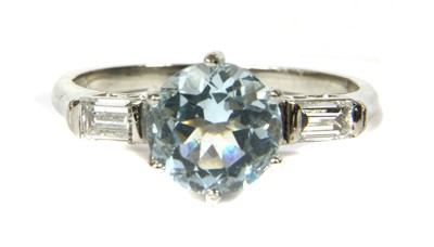 Lot 125 - A platinum aquamarine and diamond three stone ring