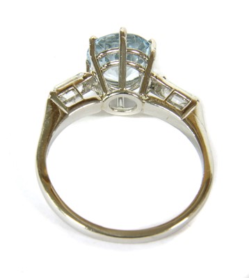 Lot 125 - A platinum aquamarine and diamond three stone ring