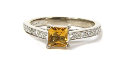 Lot 154 - An 18ct white gold citrine and diamond ring