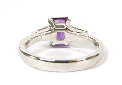 Lot 146 - A white gold amethyst and diamond three stone ring