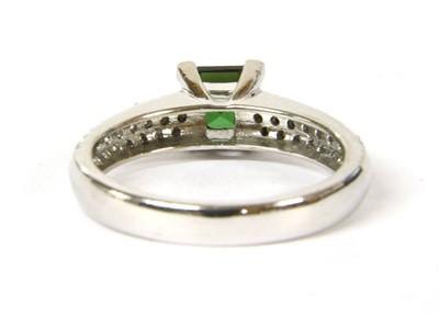 Lot 95 - An 18ct white gold green tourmaline and diamond ring