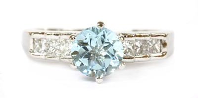 Lot 134 - A platinum blue topaz and diamond ring