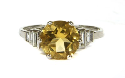 Lot 155 - A platinum citrine and diamond ring