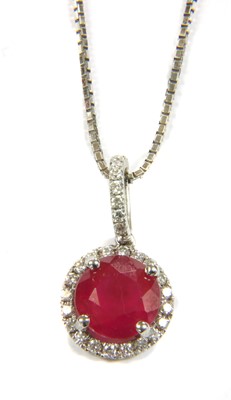 Lot 50 - An 18ct white gold ruby and diamond cluster pendant