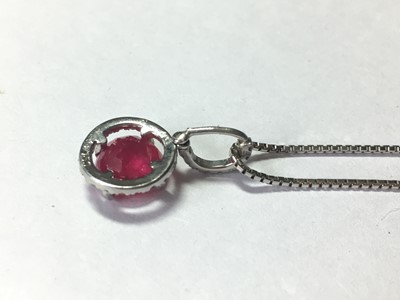 Lot 50 - An 18ct white gold ruby and diamond cluster pendant