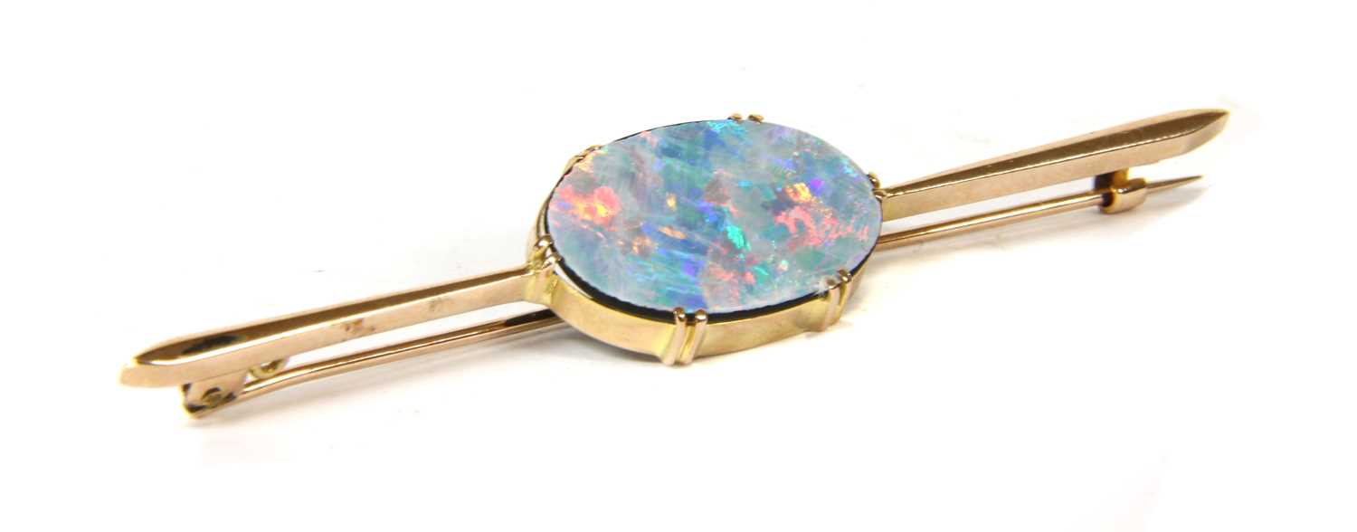 Lot 5 - A gold opal doublet bar brooch