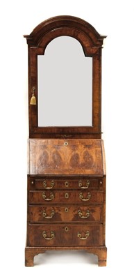 Lot 590 - A George I walnut dome top bureau cabinet