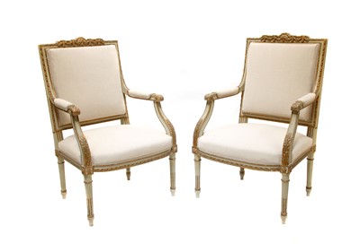 Lot 512 - A pair of Louis XVI-style gilded and grey painted wood armchairs