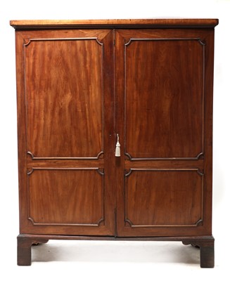 Lot 542 - A George III mahogany panelled wardrobe