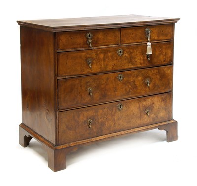 Lot 586 - A Queen Anne walnut chest of drawers