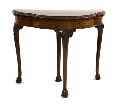 Lot 535 - A 1920s burr walnut foldover top card table