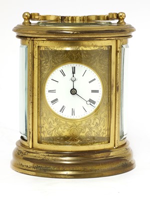 Lot 702 - A gilt brass carriage clock