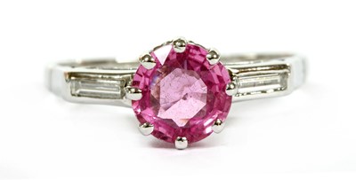 Lot 214 - A platinum pink sapphire and diamond ring