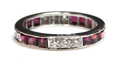 Lot 249 - An 18ct white gold ruby and diamond full eternity ring