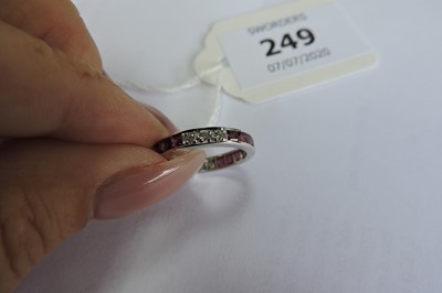 Lot 249 - An 18ct white gold ruby and diamond full eternity ring