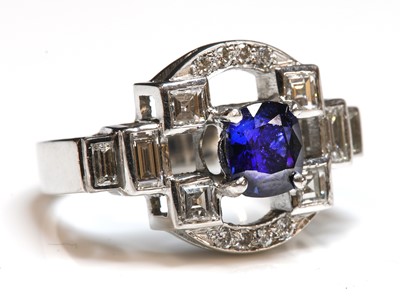 Lot 57 - An 18ct white gold sapphire and diamond ring
