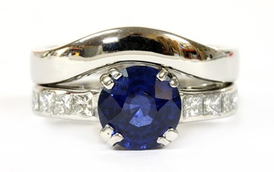 Lot 105 - A white gold sapphire and diamond ring