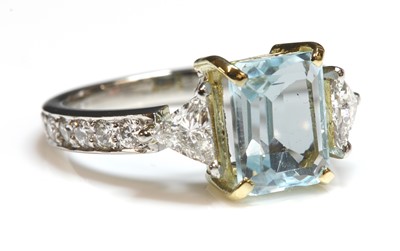 Lot 110 - A platinum blue topaz and diamond ring