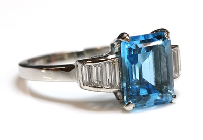 Lot 258 - A platinum blue topaz and diamond ring
