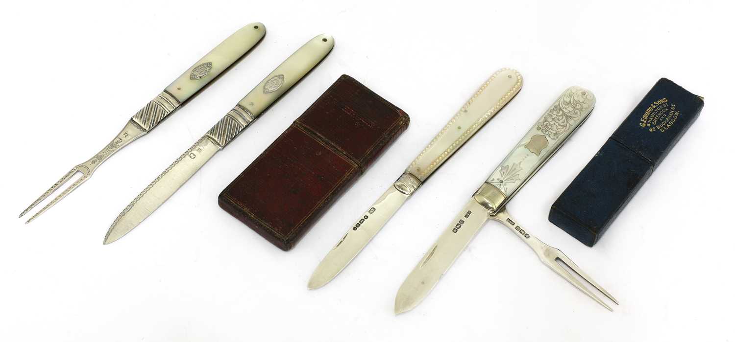 Lot 26 - Four silver and mother-of-pearl folding fruit knives and forks