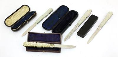 Lot 49 - Four Victorian carved mother-of-pearl and silver folding fruit knives