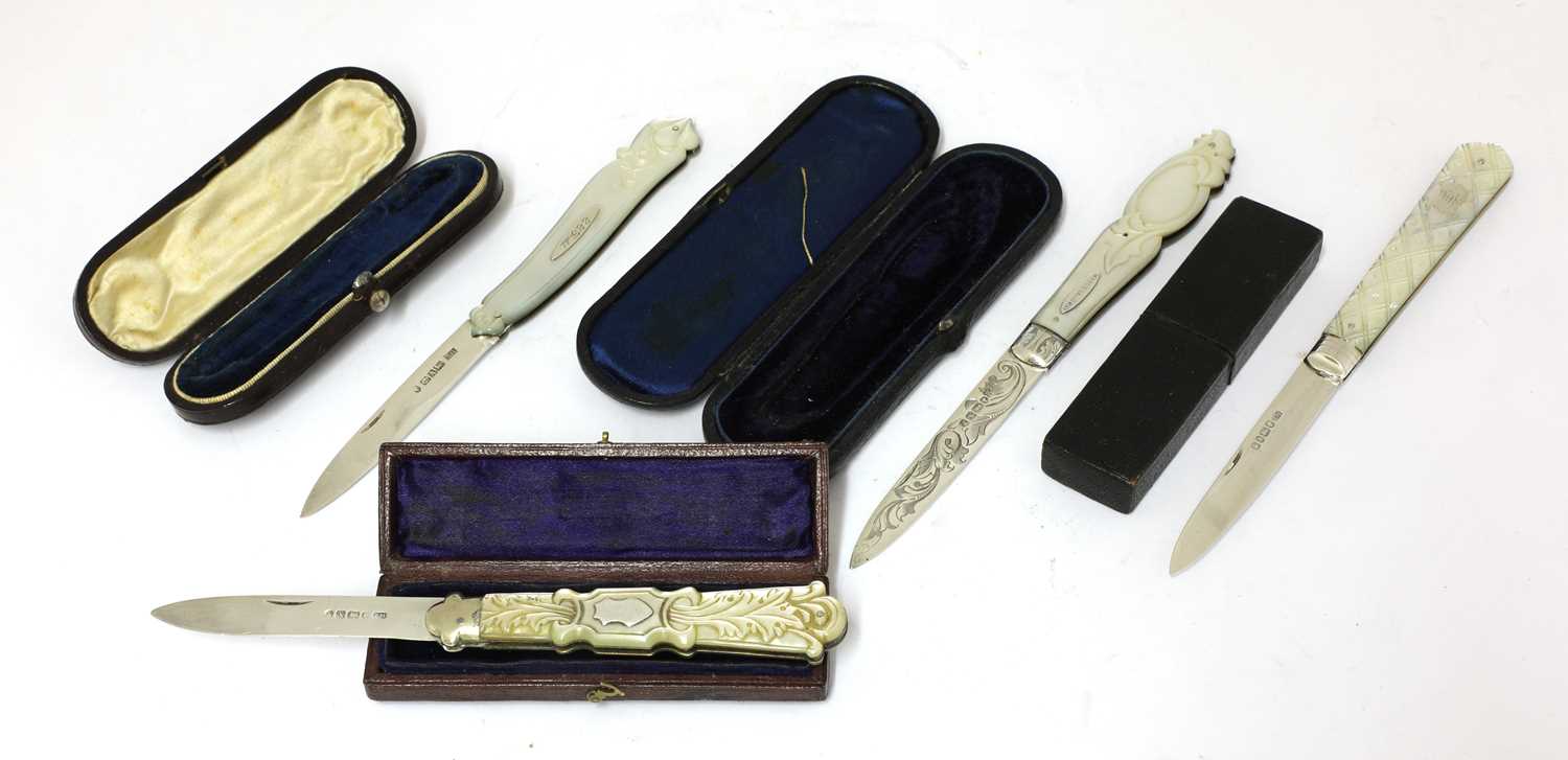 Lot 49 - Four Victorian carved mother-of-pearl and silver folding fruit knives