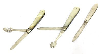Lot 24 - Three silver and mother-of-pearl combination folding fruit knives