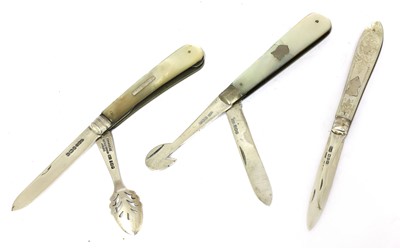 Lot 24 - Three silver and mother-of-pearl combination folding fruit knives