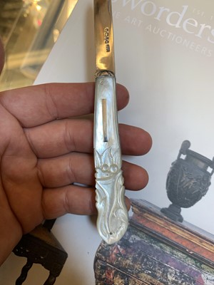 Lot 23 - Three silver and mother-of-pearl combination folding fruit knives