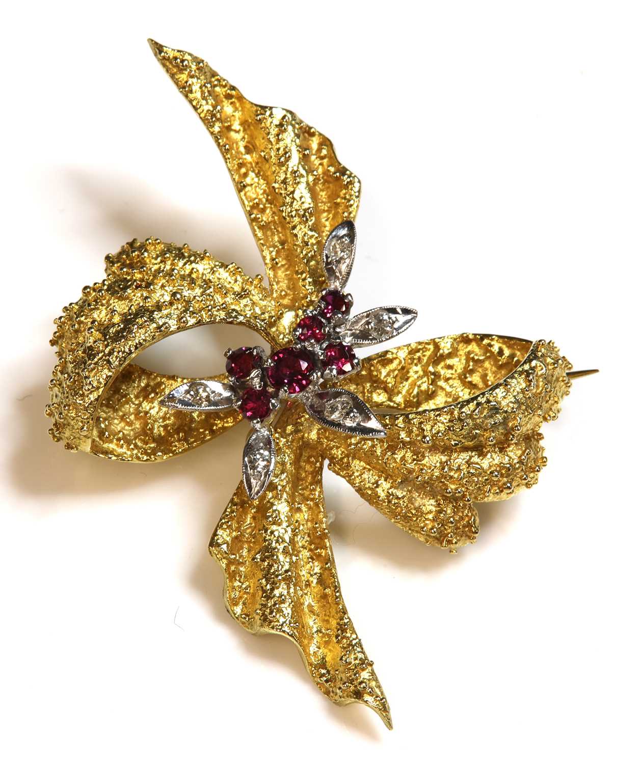 Lot 48 - An 18ct gold two colour ruby and diamond bow brooch, c.1950