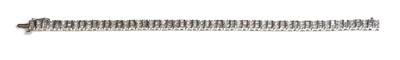 Lot 98 - A white gold diamond set line bracelet