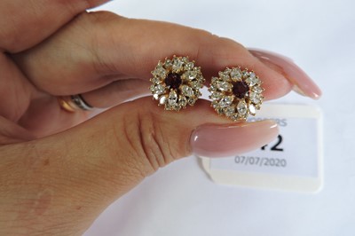Lot 66 - A pair of gold ruby and diamond cluster earrings
