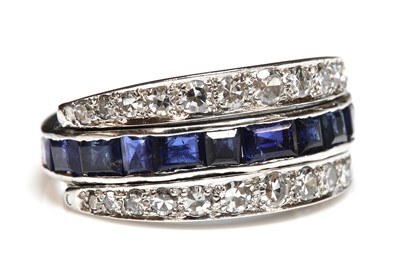Lot 230 - An 18ct white gold sapphire and diamond half hoop ring